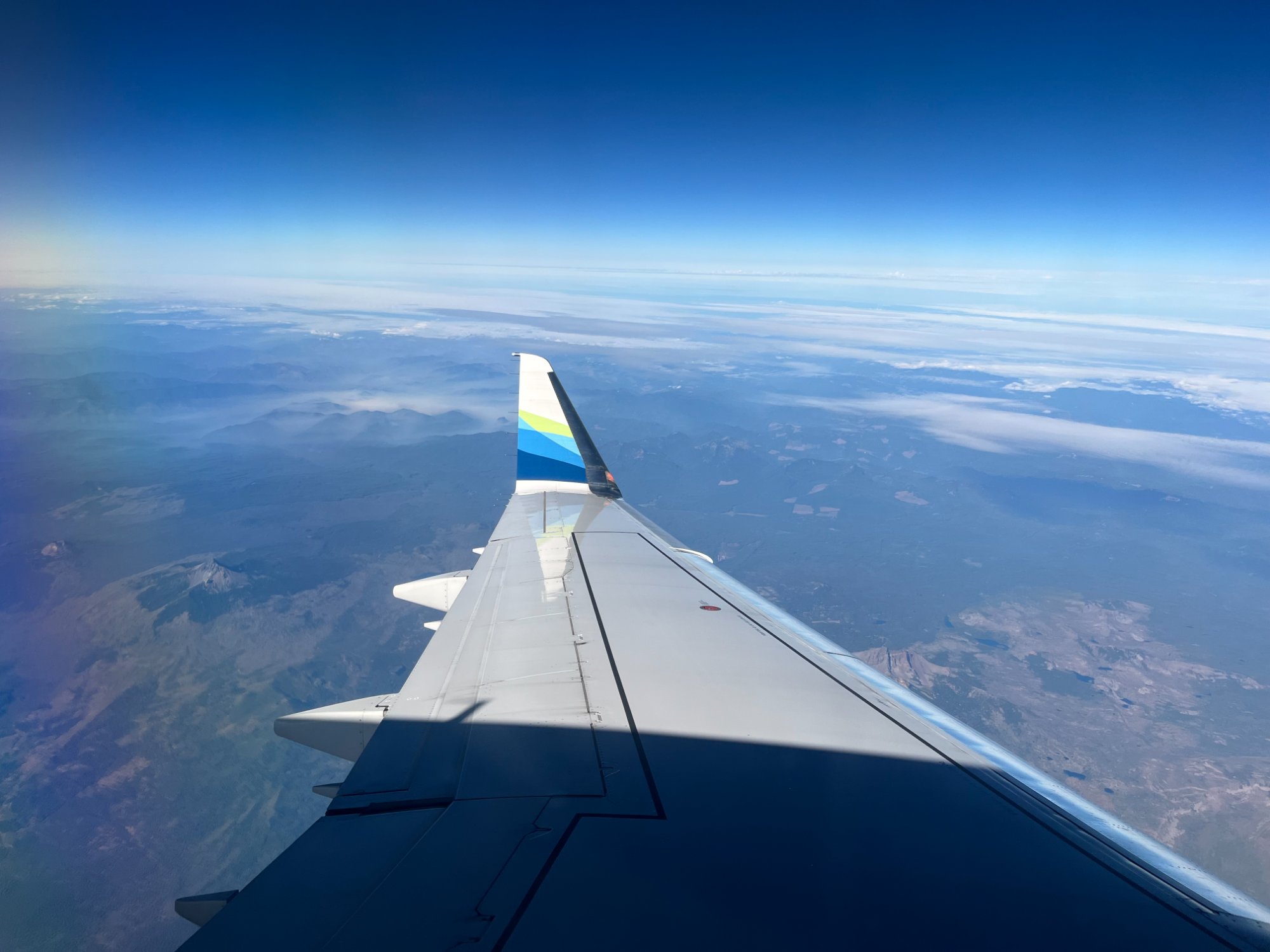 View from cockpit over snowy Rockies