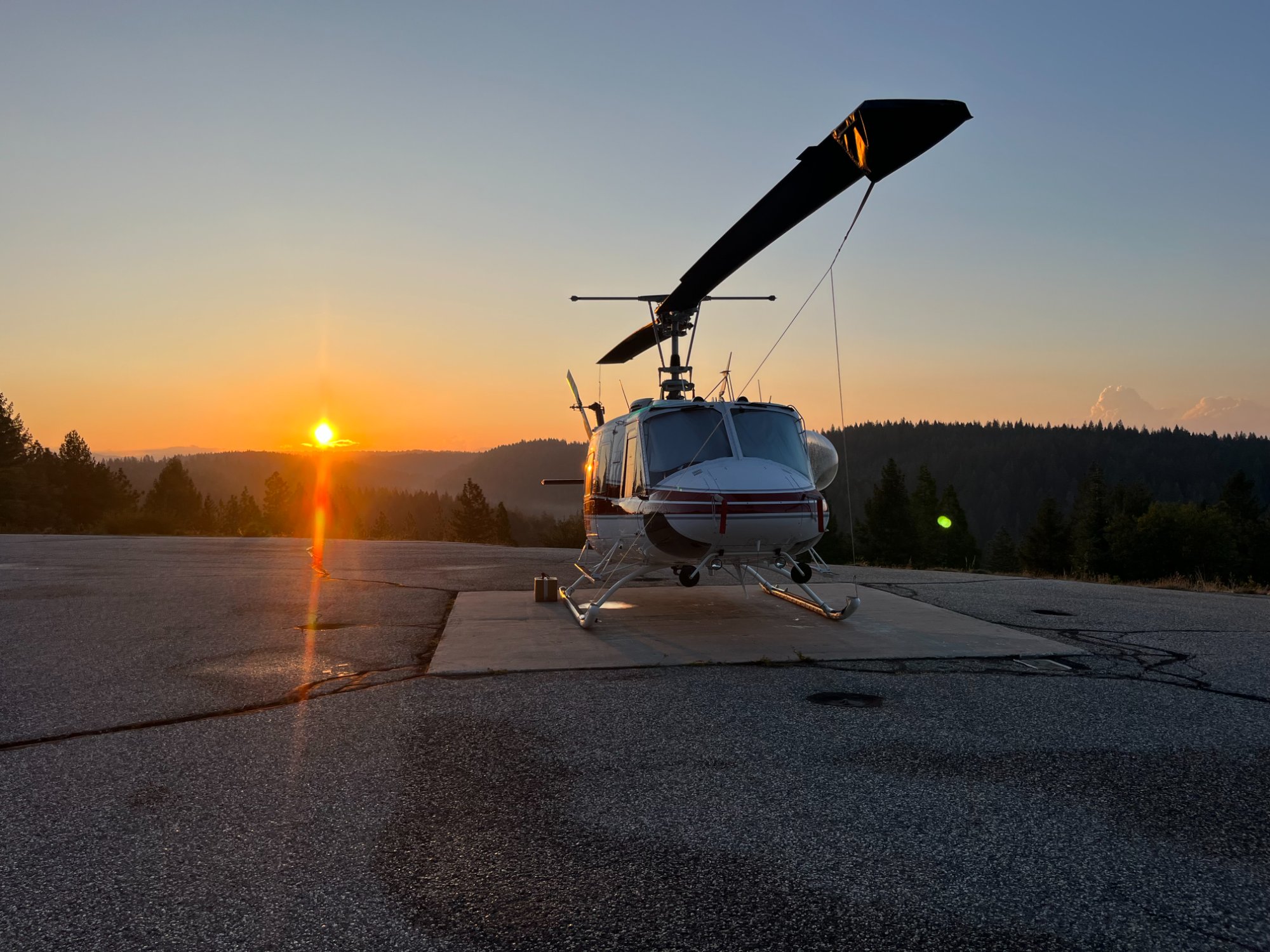 Helicopter at sunset on helipad