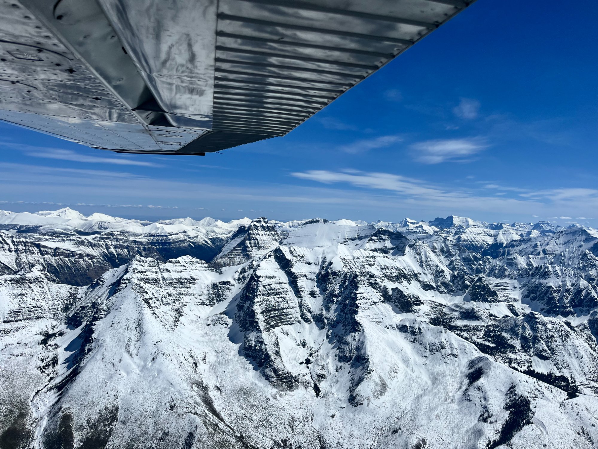 Snowy mountains from aircraft wing